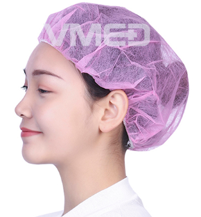 Woman Wearing Pink Disposable Bouffant Cap for Food Processing